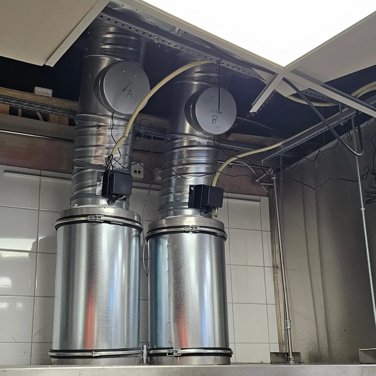Lynx Kitchen centrifugal grease separator installed in a commercial kitchen