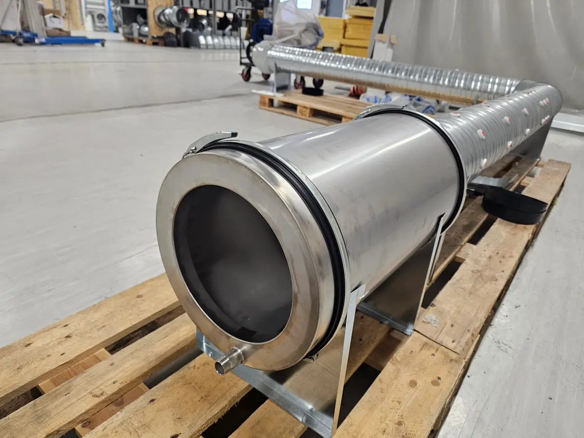 Lynx Kitchen centrifugal grease separator against a concrete wall